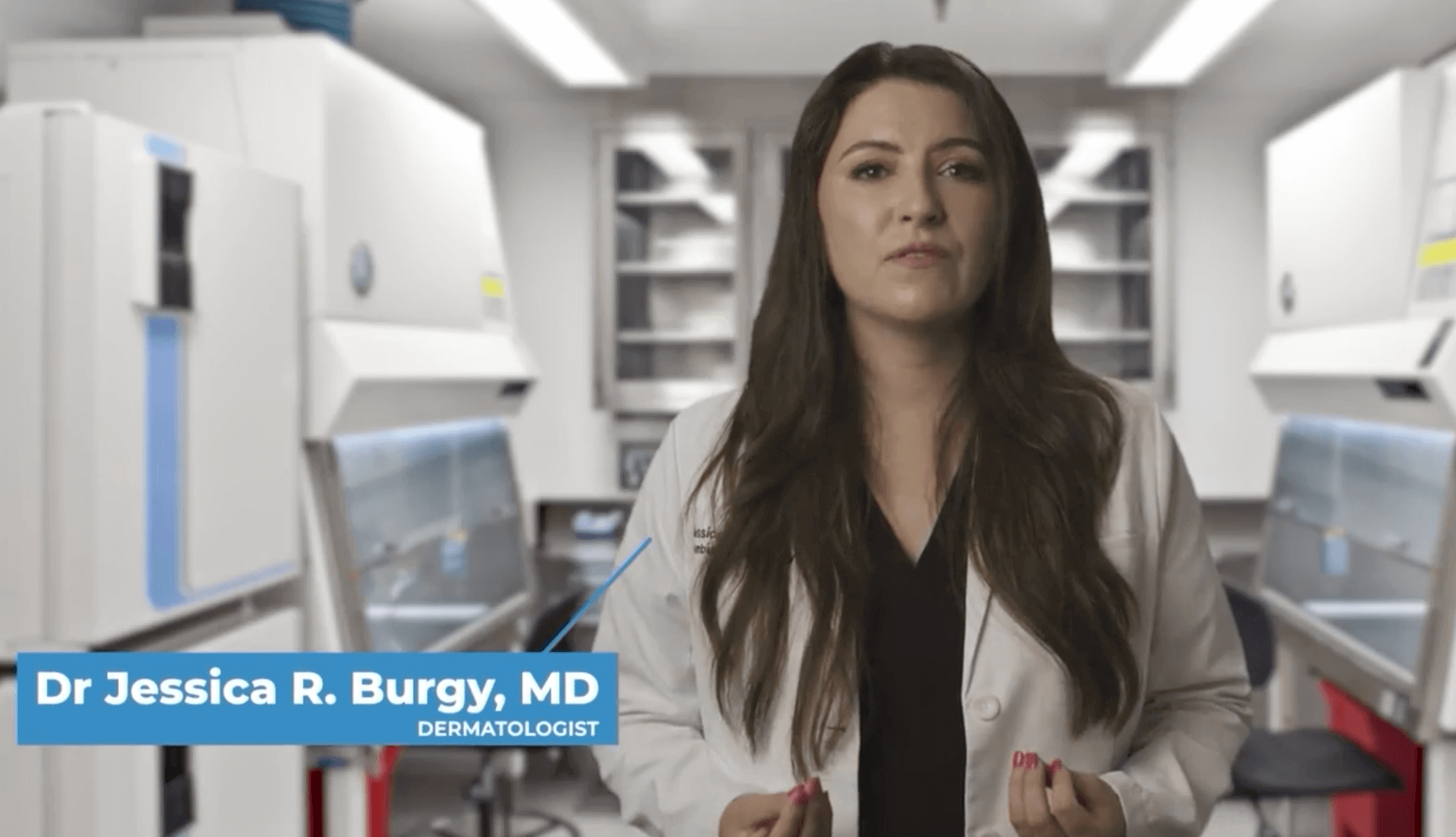 Dermatologist speaking in a lab setting